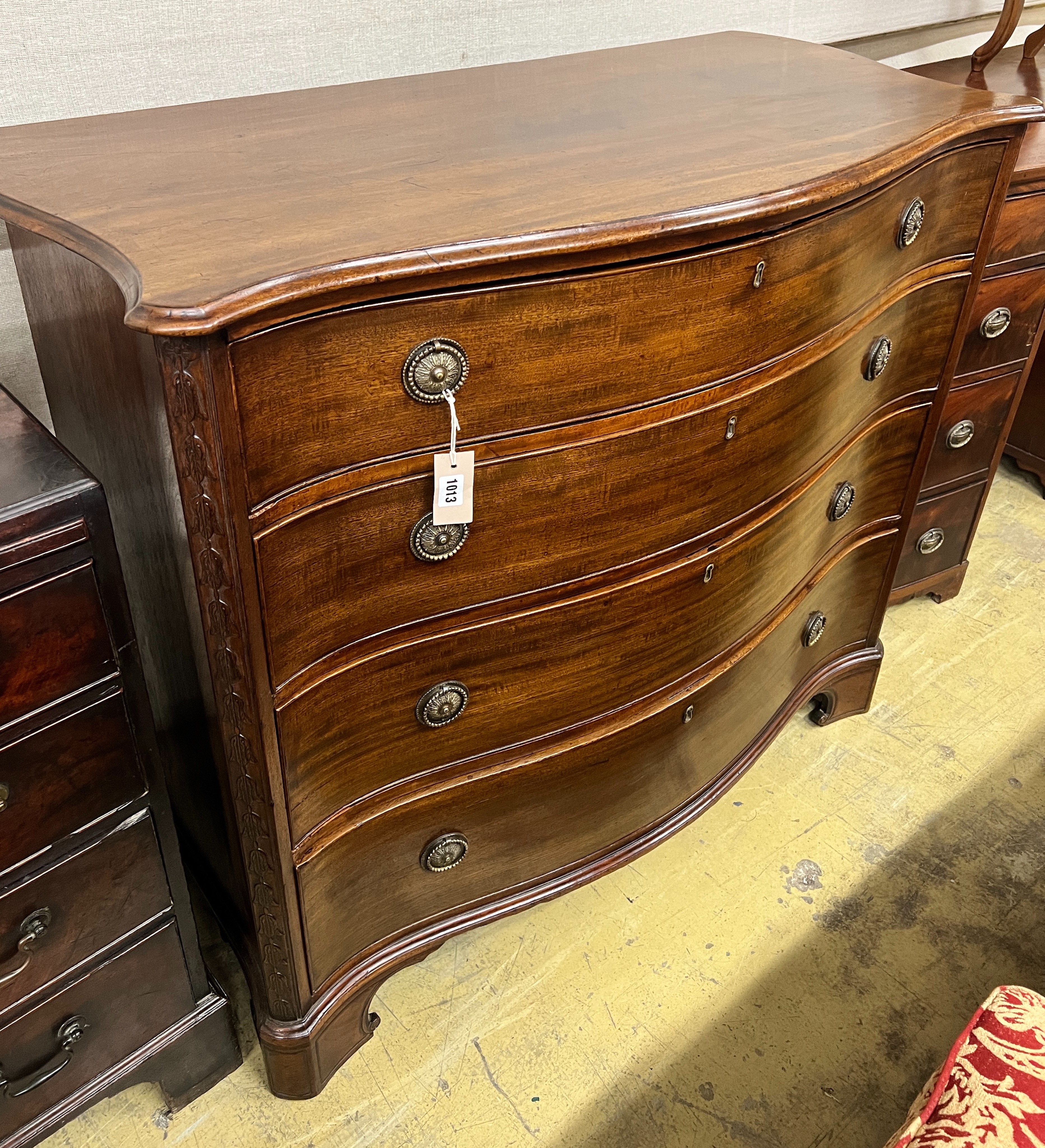 A George III mahogany four drawer serpentine chest, width 111cm, depth 55cm, height 98cm